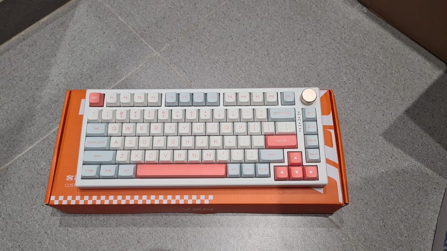 Keyboard with a unique design on an orange box against a gray background